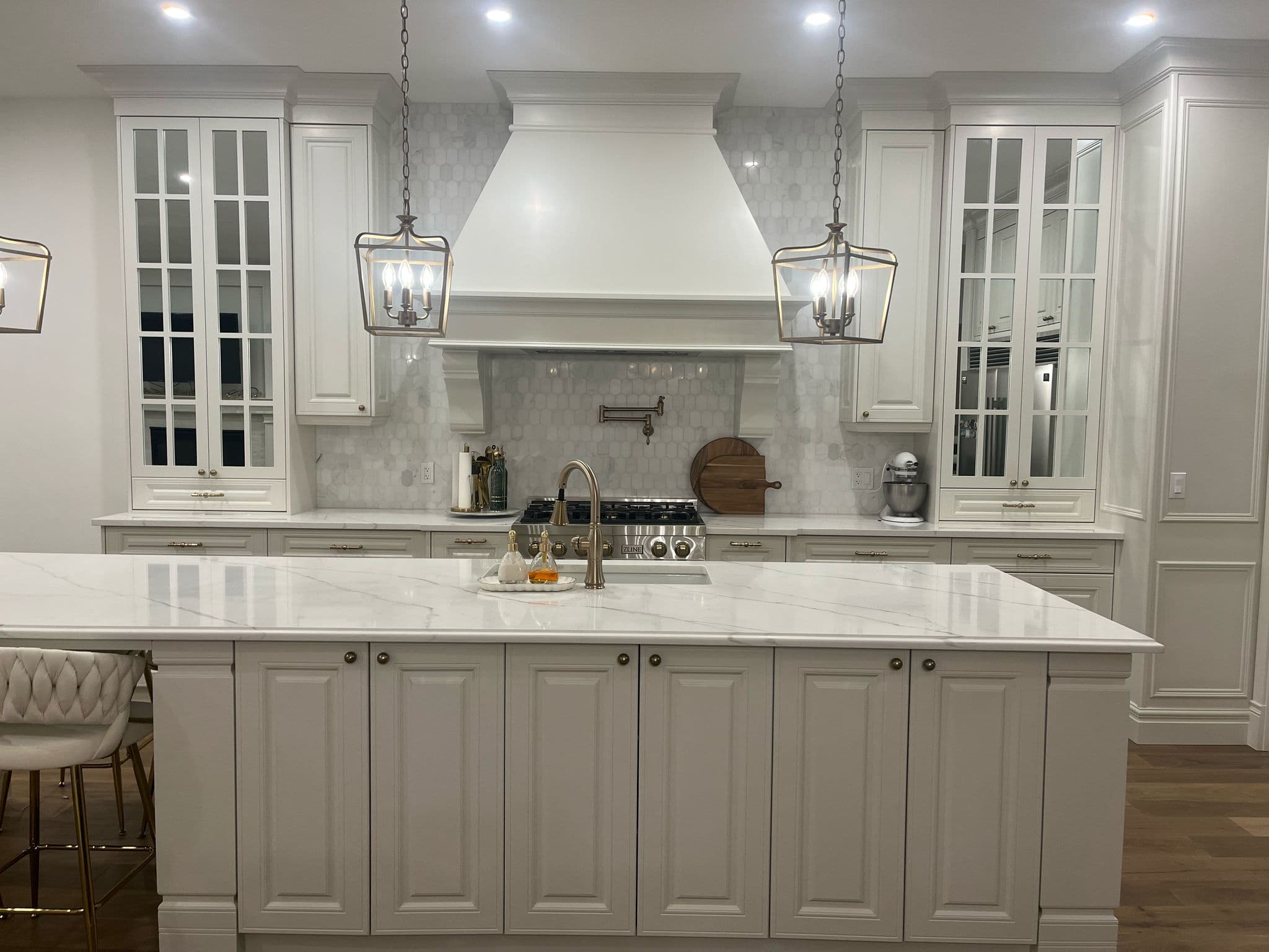 White Kitchen Oasis with Dining Area - Luxe Kitchen Cabinets