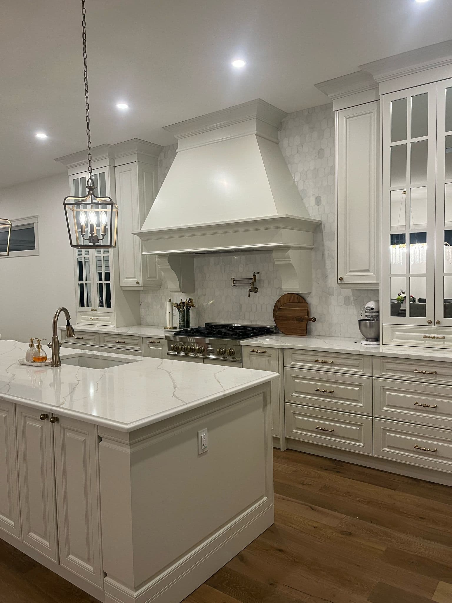 White Kitchen Oasis with Dining Area - Luxe Kitchen Cabinets